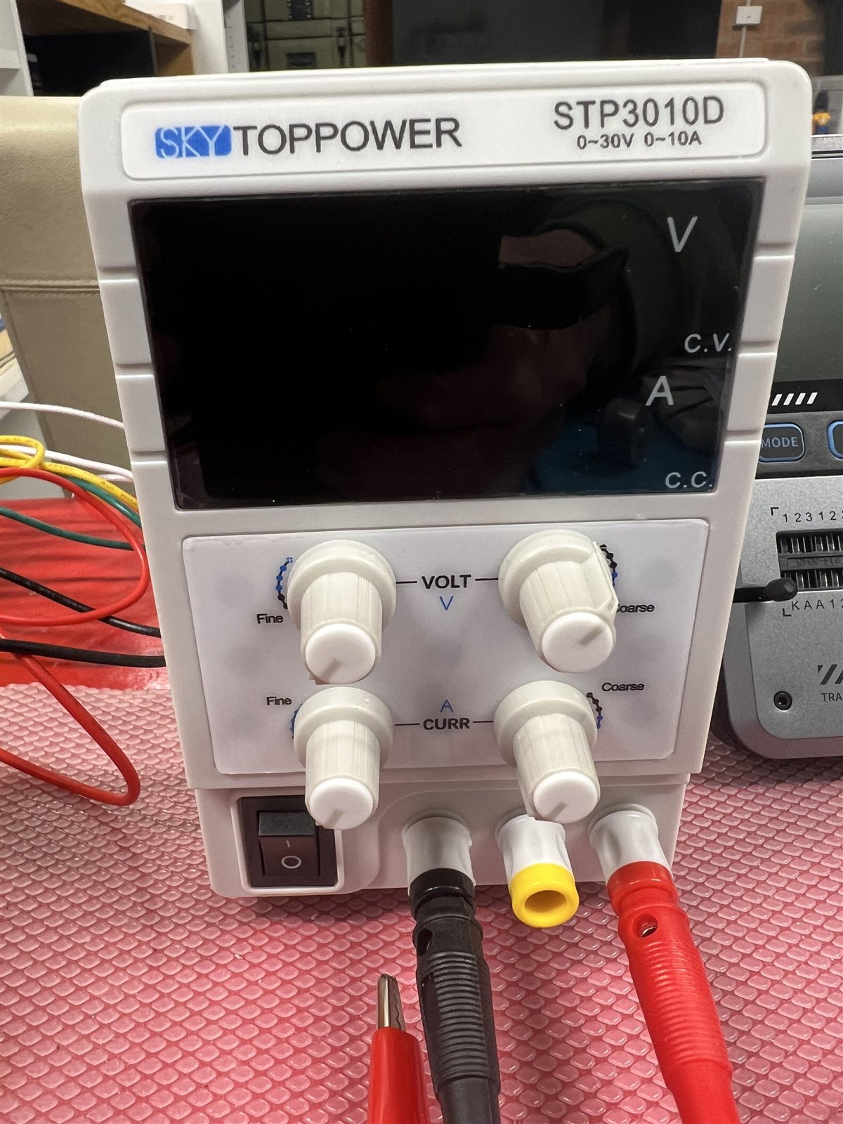 The coarse and fine voltage and current controls on the STP3010D bench supply