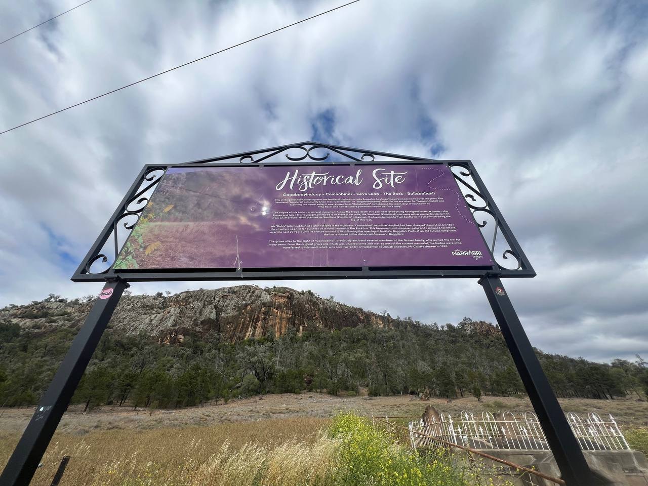 The interpretive sign at Gin's Leap below the rock face